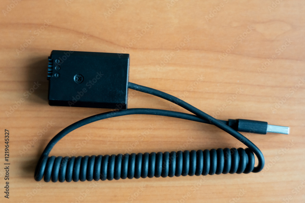 Battery adapter with USB connector for powering the camera