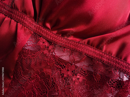 Close-up of a women's burgundy peignoir. Clothes, women's underwear, texture.