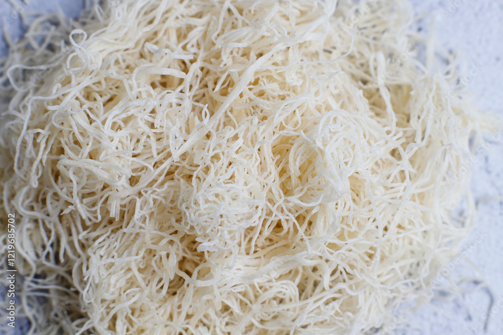 Homemade uncooked kataifi or kadaifi dough. Homemade uncooked kataifi or kadaifi dough.