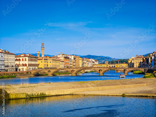 Ponte alla Carraia bridge and the historic old town houses over River Arno in Florence, Italy photo