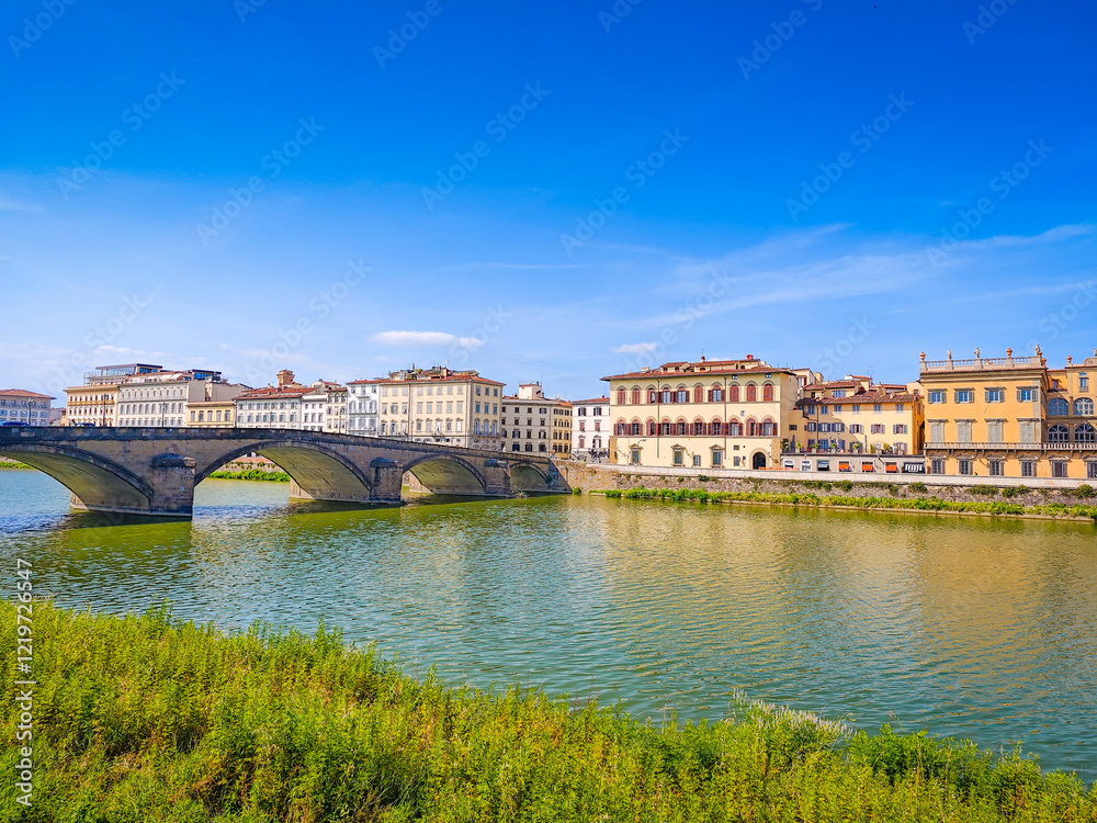 Fototapeta premium Ponte alla Carraia bridge and the historic old town houses over River Arno in Florence, Italy
