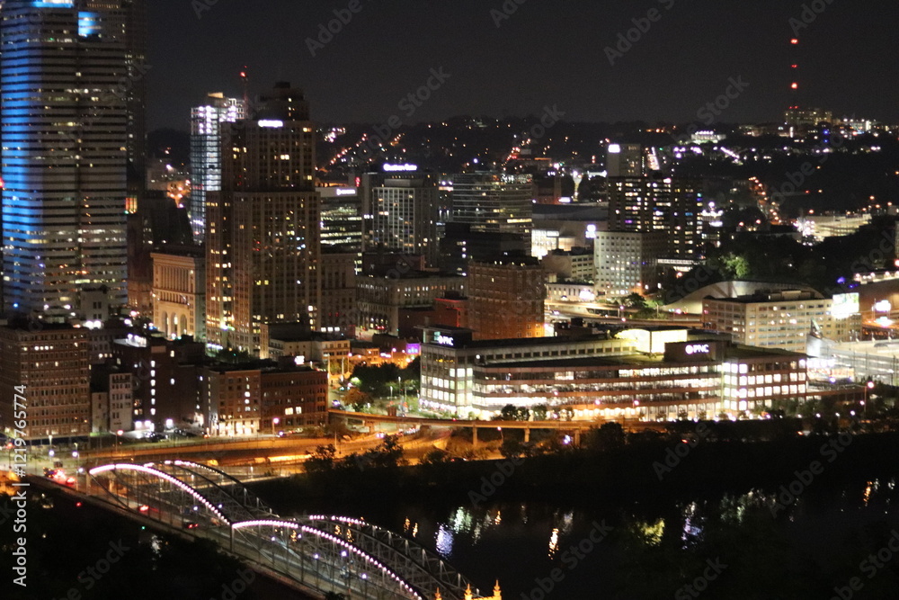 Fototapeta premium Birds eye view of the city skyline of downtown Pittsburgh, Pennsylvania at night.