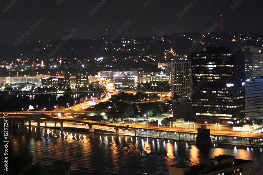 Birds eye view of the city skyline of downtown Pittsburgh, Pennsylvania at night. Birds eye view of the city skyline of downtown Pittsburgh, Pennsylvania at night.
