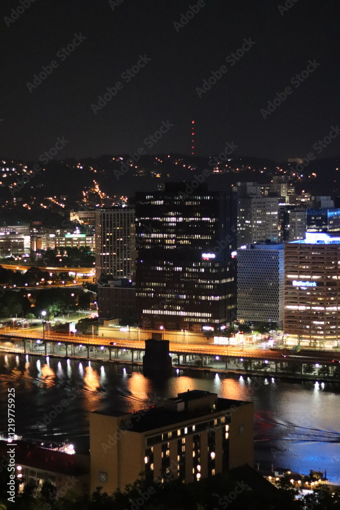 Fototapeta premium Birds eye view of the city skyline of downtown Pittsburgh, Pennsylvania at night.