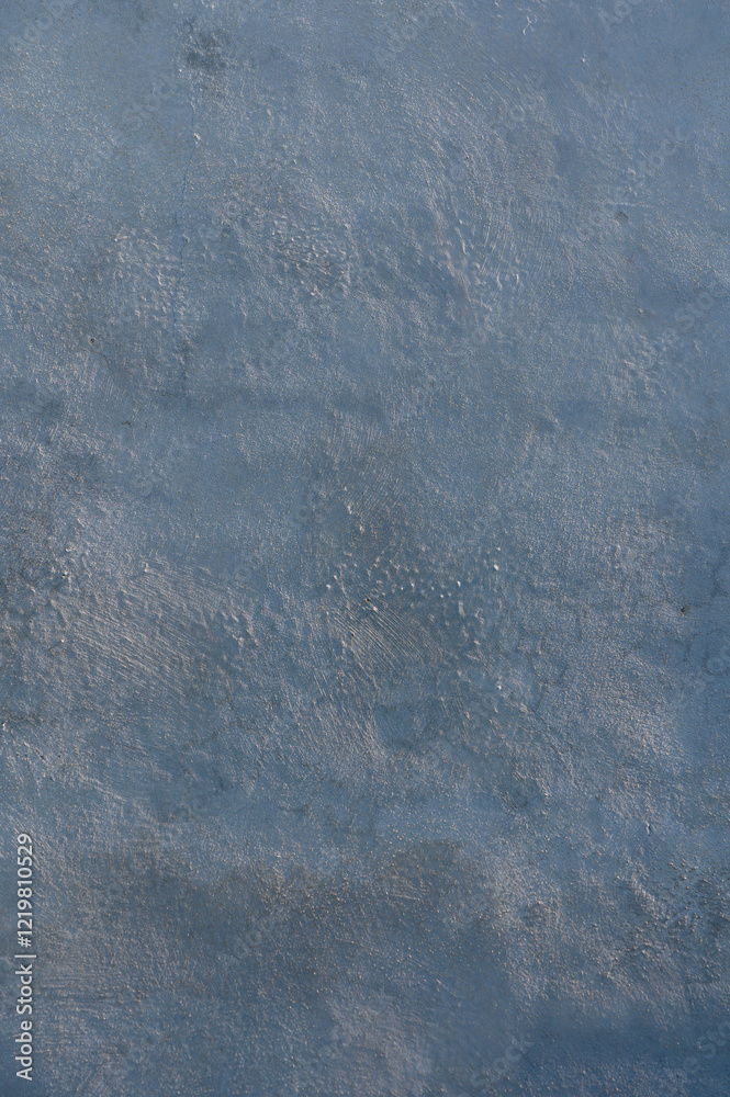 Obraz premium Texture of a tranquil surface reflecting soft hues at dawn near the calm lake