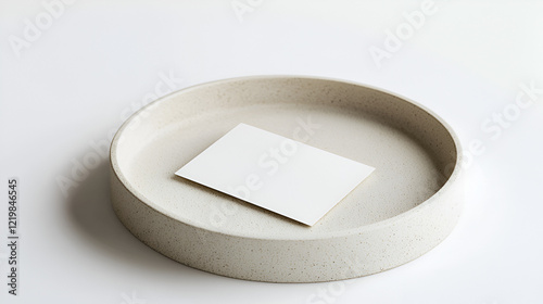 Blank card on a speckled beige tray.  Perfect for mockup or branding designs.