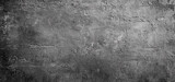 Grunge gray concrete wall texture with dark industrial background creates a rough and aged surface perfect for overlay