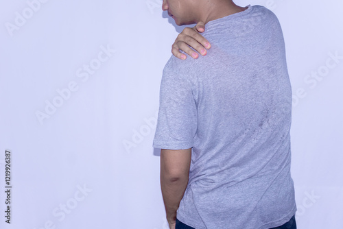 Wallpaper Mural Asian man holding back having symptom pain hurt suffering concept isolated on white Torontodigital.ca