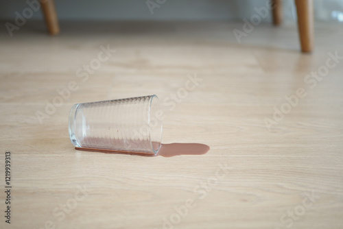 Accident Prone A Glass Has Been Spilled on the Wooden Floor photo