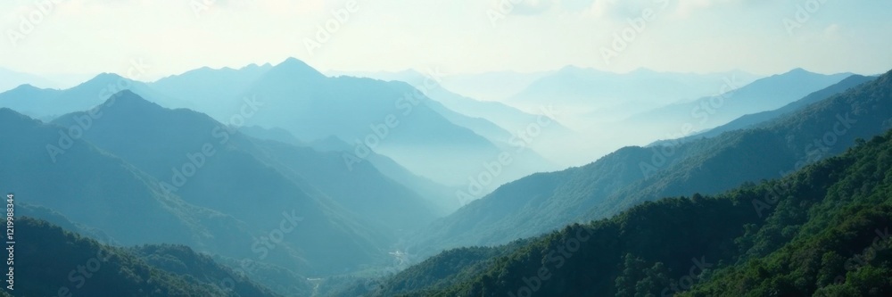 Misty mountains with layered peaks shrouded in fog, verdant, mountains Misty mountains with layered peaks shrouded in fog, verdant, mountains