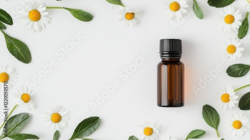 Amber Bottle with Chamomile Petals and Leaves photo