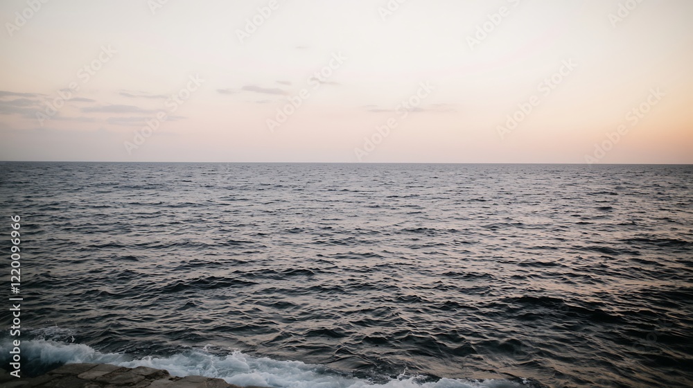 A peaceful ocean at dawn, the sky filled with soft pastel colors as the sun rises. The gentle waves move across the surface of the water, creating a calm and serene atmosphere with the first A peaceful ocean at dawn, the sky filled with soft pastel colors as the sun rises. The gentle waves move across the surface of the water, creating a calm and serene atmosphere with the first
