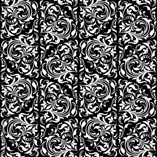 Wallpaper in the style of Baroque. Seamless vector background. White and black floral ornament. Graphic pattern for fabric, wallpaper, packaging. Ornate Damask flower ornament.