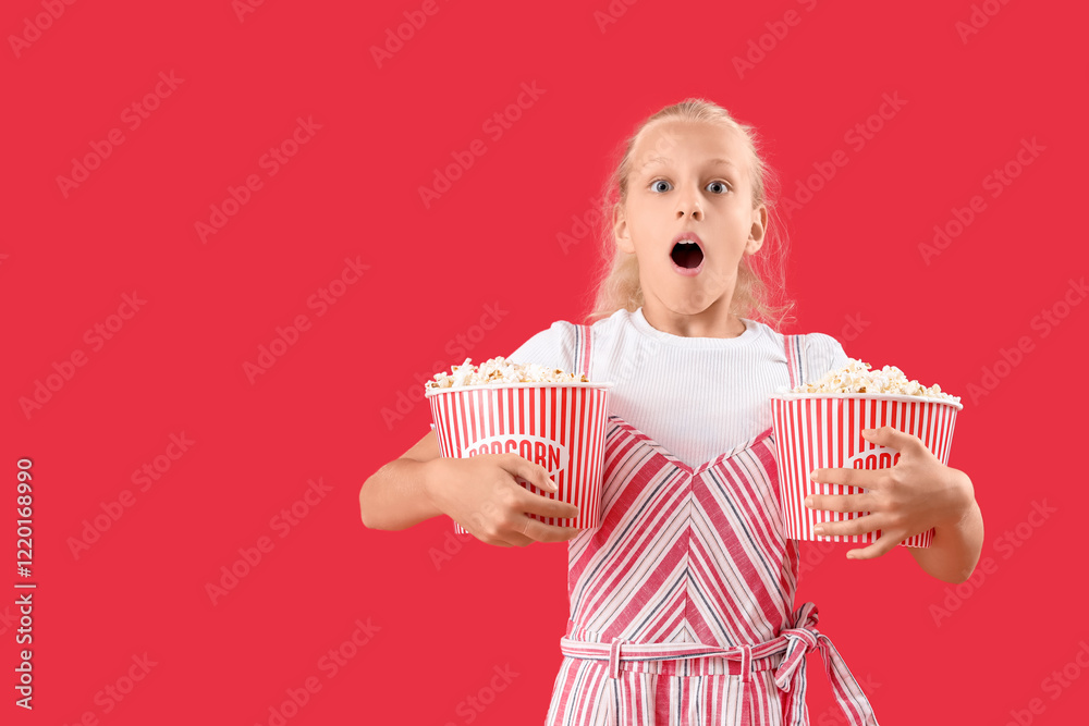 Shocked girl with buckets of popcorn on red background Shocked girl with buckets of popcorn on red background