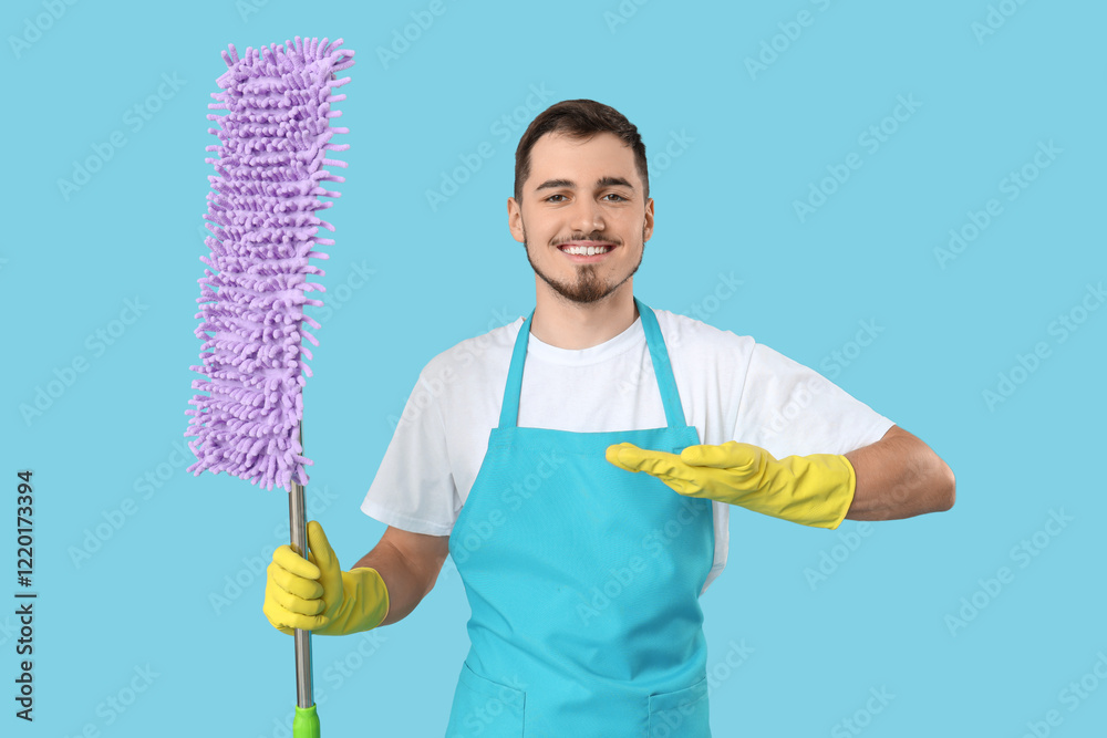Male janitor with floor mop on blue background Male janitor with floor mop on blue background