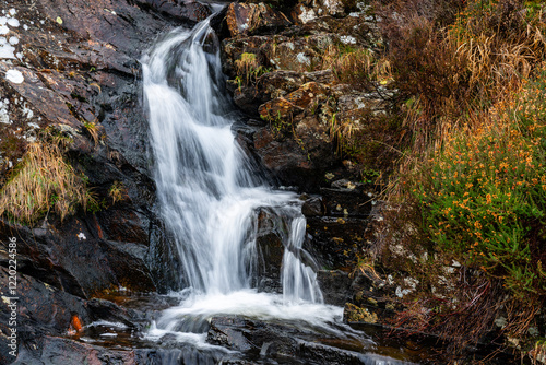 Small waterfall tumbling down Moelwyn mountains photo