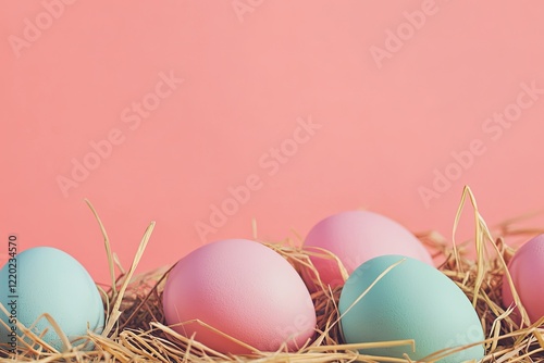 vibrant display of pastel easter eggs nestled in straw set against bright background with ample copy space for seasonal photo