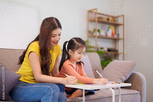 A mother assisting her daughter with homework at the table, surrounded by books and stationery, fostering learning and support.