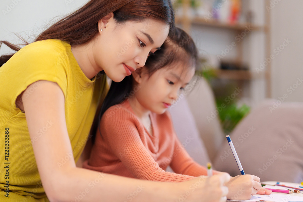 A mother assisting her daughter with homework at the table, surrounded by books and stationery, fostering learning and support. A mother assisting her daughter with homework at the table, surrounded by books and stationery, fostering learning and support.