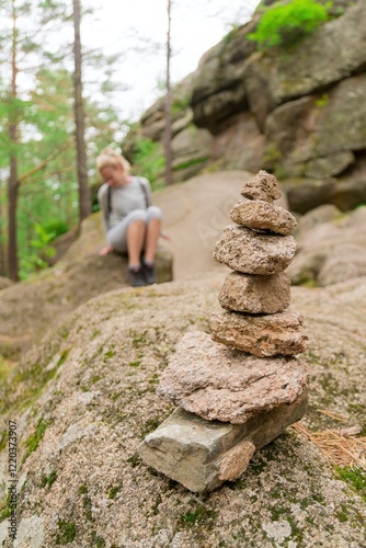 A young white woman travels through the summer of rocks and stones
