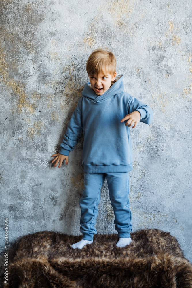 A cheerful and joyful child is energetically playing against a textured wall, exuding pure happiness in a bright, colorful indoor environment A cheerful and joyful child is energetically playing against a textured wall, exuding pure happiness in a bright, colorful indoor environment
