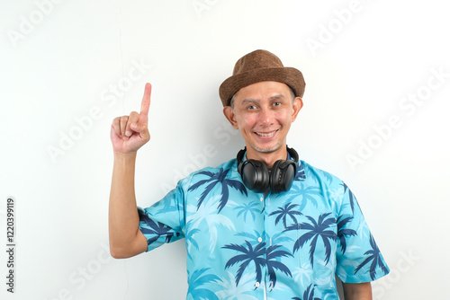 Adult Asian Man smile and pointing up with both hands. Concept of joy, enthusiasm and positivity
 photo