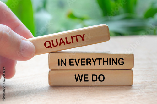 Quality in everything we do text on wooden blocks. Business quality concept photo