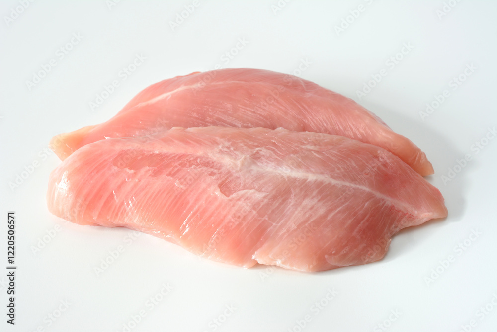 Raw Turkey Breast Fillets isolated on white close up Raw Turkey Breast Fillets isolated on white close up