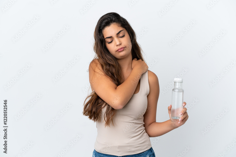 Young caucasian woman with a bottle of water isolated on white background suffering from pain in shoulder for having made an effort Young caucasian woman with a bottle of water isolated on white background suffering from pain in shoulder for having made an effort