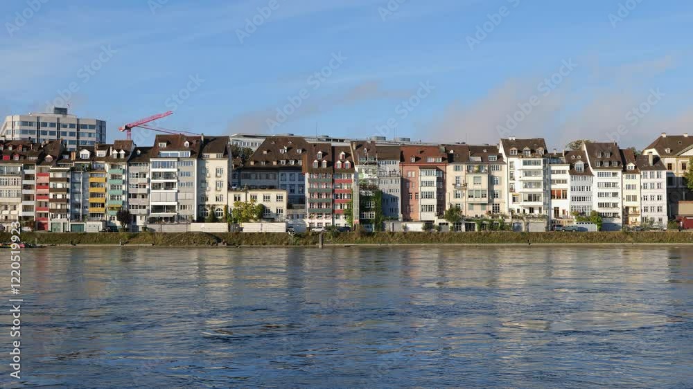City skyline of Basel in Switzerland, residential architecture at Rhine River waterfront, row of apartment buildings. City skyline of Basel in Switzerland, residential architecture at Rhine River waterfront, row of apartment buildings.