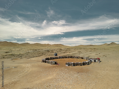 An unusual animal enclosure made from car parts. A self-made animal pen in Mongolia. Animal storage area. A pasture for animals. Transformers. photo