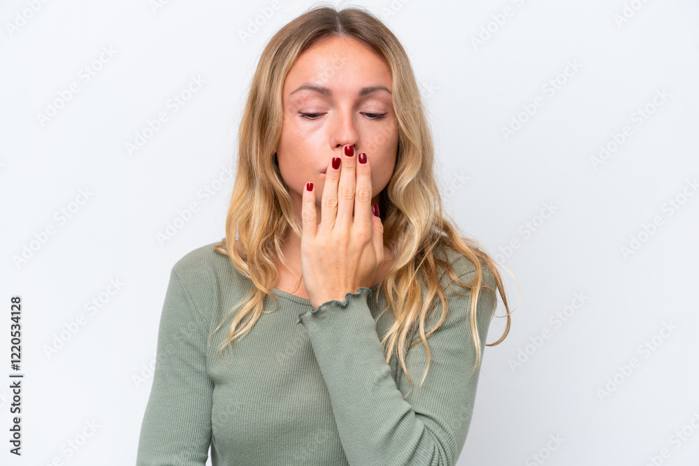 Young Russian woman isolated on white background covering mouth with hand Young Russian woman isolated on white background covering mouth with hand