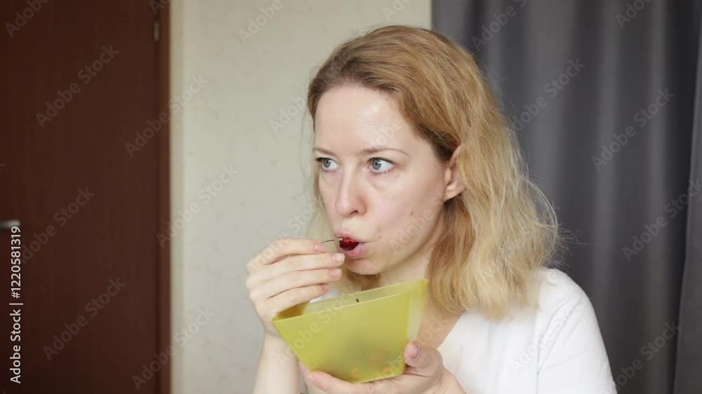 Woman Eating Cherry Berry, enjoying fruit snack Woman Eating Cherry Berry, enjoying fruit snack