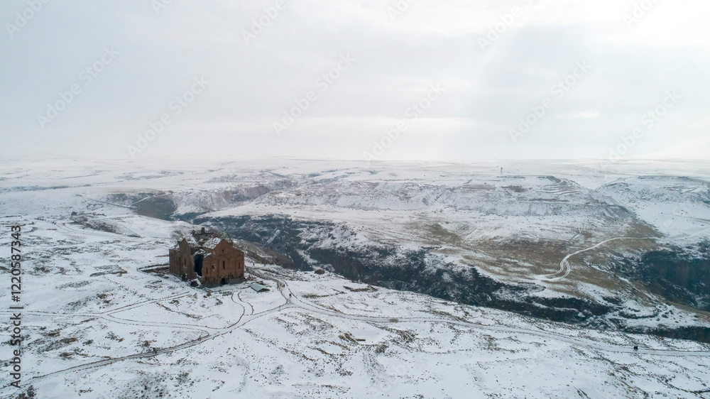 Ani Cathedral in the Ani Ruins in Kars, Turkey. Drone photo of the Ani Cathedral under the snow. Ani Cathedral in the Ani Ruins in Kars, Turkey. Drone photo of the Ani Cathedral under the snow.