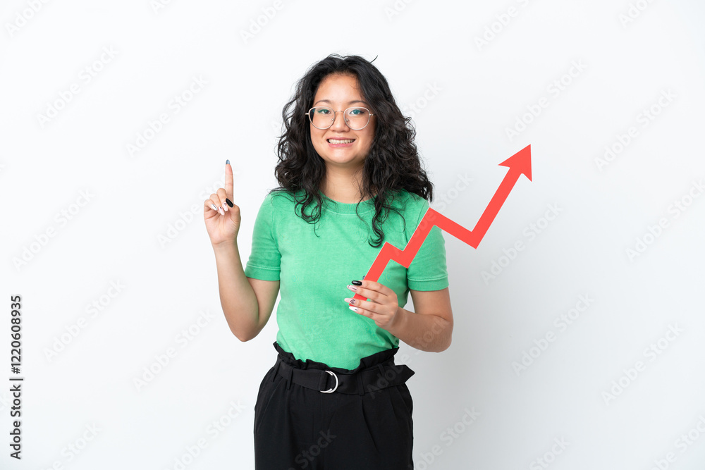 Young asian woman isolated on white background holding a catching a rising arrow and pointing up Young asian woman isolated on white background holding a catching a rising arrow and pointing up