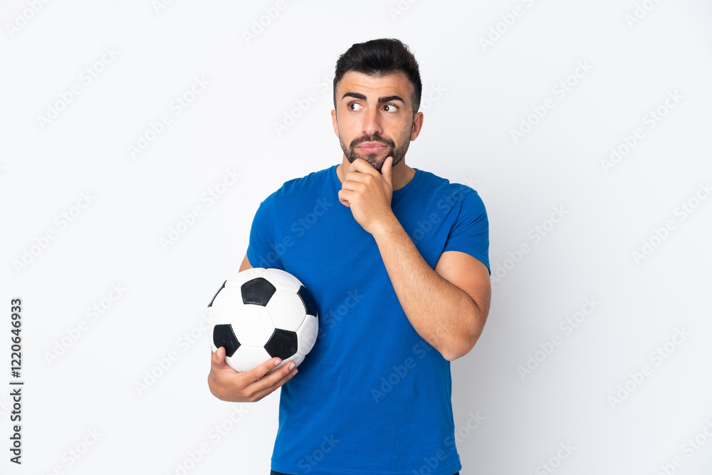 Handsome young football player man over isolated wall having doubts and thinking Handsome young football player man over isolated wall having doubts and thinking