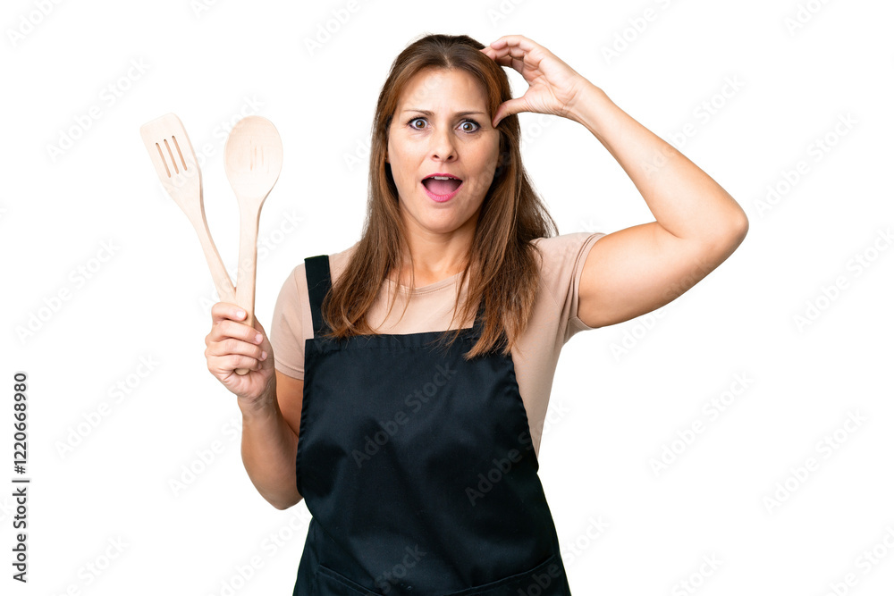 Middle age caucasian woman holding a rolling pin over isolated background with surprise expression Middle age caucasian woman holding a rolling pin over isolated background with surprise expression