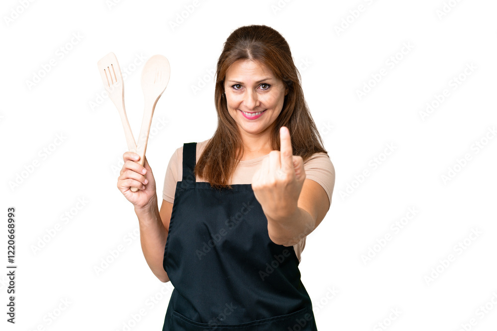 Middle age caucasian woman holding a rolling pin over isolated background doing coming gesture Middle age caucasian woman holding a rolling pin over isolated background doing coming gesture
