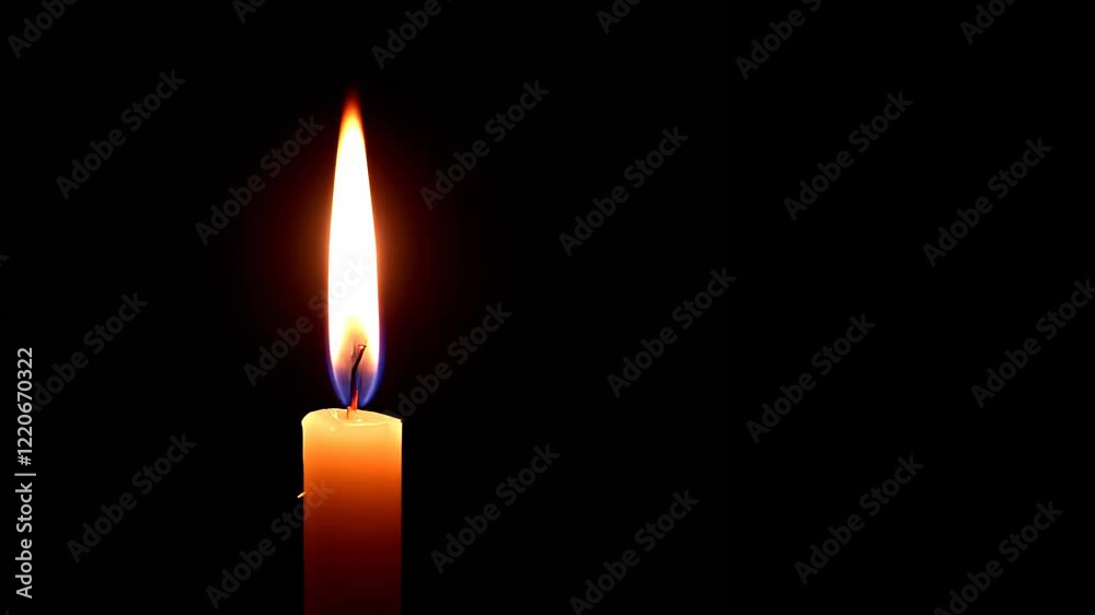 Steady candle flame dance in darkness: illuminating warmth and serenity