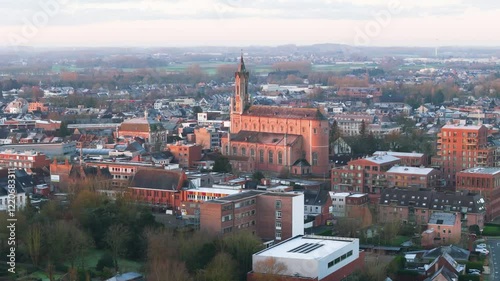 Wallpaper Mural sun illuminating church wetteren belgium dynamically to showcase city hall surrounding town sunrise close up circling aerial shot close-up visuals architecture  Torontodigital.ca