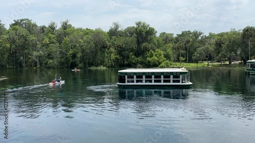 Tourist boat and kayak at Silver Springs, Florida