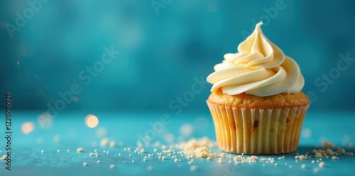 Single vanilla cupcake, blue background, lit sparkler, event, cupcake, bakery