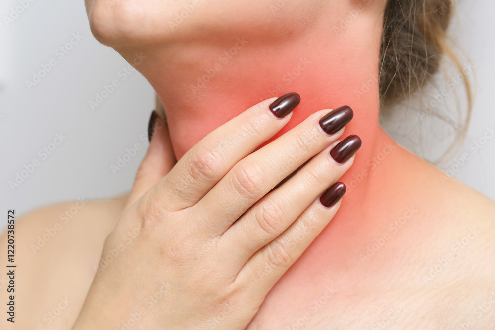 Woman holding her throat in discomfort. Experiencing a sore throat due to a cold. Tonsils pain problem. Common symptom of seasonal illness or infection. Woman holding her throat in discomfort. Experiencing a sore throat due to a cold. Tonsils pain problem. Common symptom of seasonal illness or infection.
