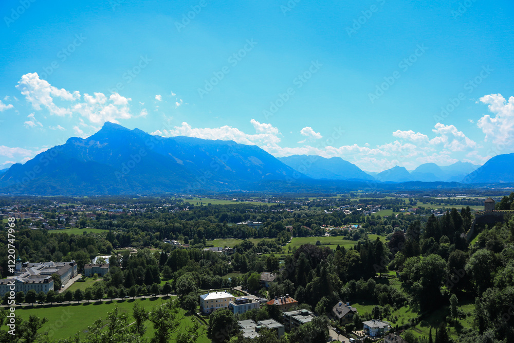 Obraz premium A panoramic view of Salzburg with lush greenery