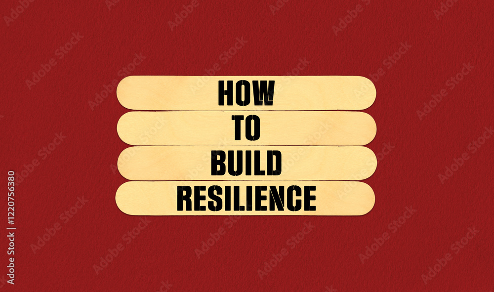 Fototapeta premium How to Build Resilience Symbol. Concept word How to Build Resilience on beautiful wooden stick. Beautiful Red Chart Paper Background. Business and How to Build Resilience concept. Copy space