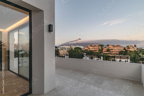 a landscape image overlooking the cloudy mountain of Marbella from luxury mediterranean real estate balcony 