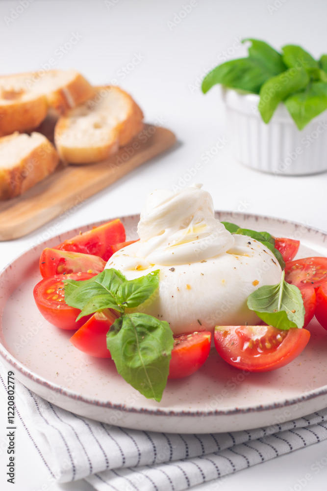Delicious Italian caprese salad with sliced mozzarella, tomatoes, basil, and bread on background. Delicious Italian caprese salad with sliced mozzarella, tomatoes, basil, and bread on background.