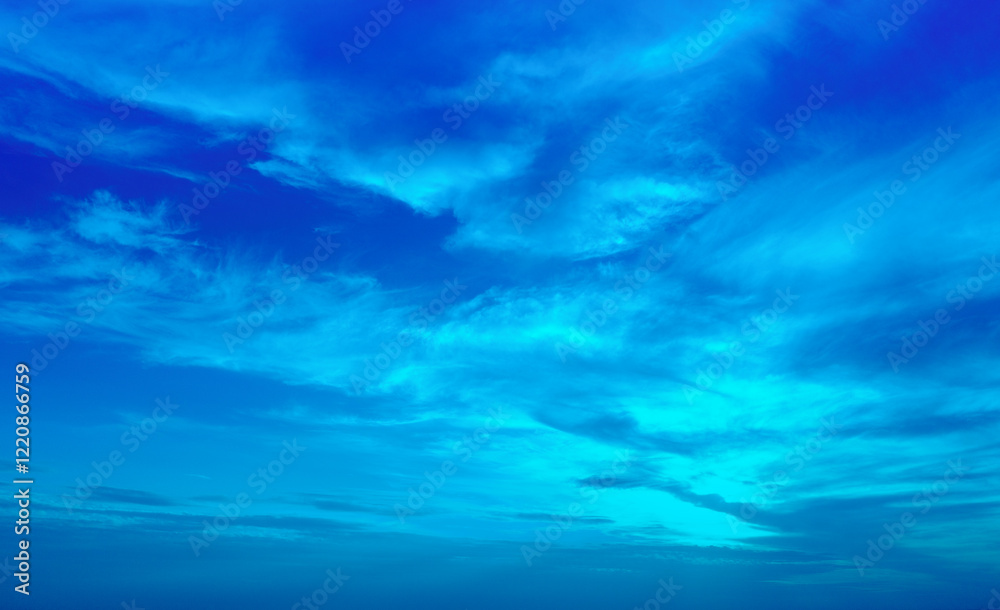 Blue cloudy sky at sunset. Sky texture. Abstract nature background