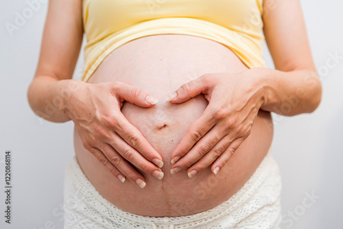 Wallpaper Mural Closeup of pregnant belly with hands holding it on white isolated background Torontodigital.ca