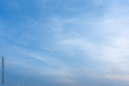 Fototapeta Naklejka Na Ścianę i Meble -  Serene Blue Sky with Wispy Clouds Calm Weather Natural Background Image
